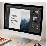 Design and pre-press mockup on a desktop monitor with layout tools and color swatches.
